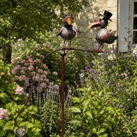 Balancier de jardin avec deux corbeaux et boule en verre