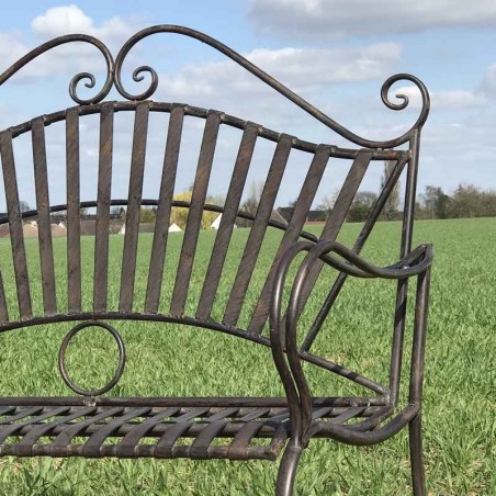 Banc de jardin fer forgé arabesque vue de près