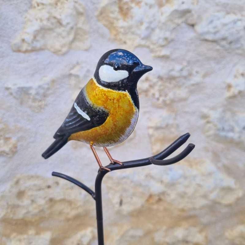 Oiseau décoratif sur pic jaune