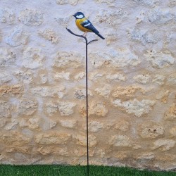 Oiseau décoratif sur pic jaune
