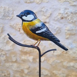 Oiseau décoratif sur pic jaune