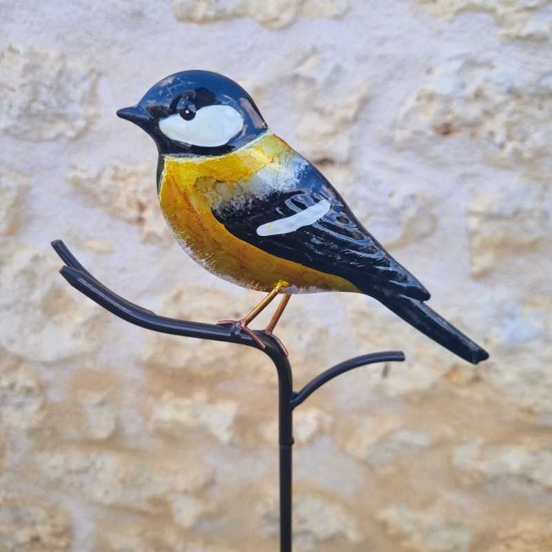 Oiseau décoratif sur pic jaune