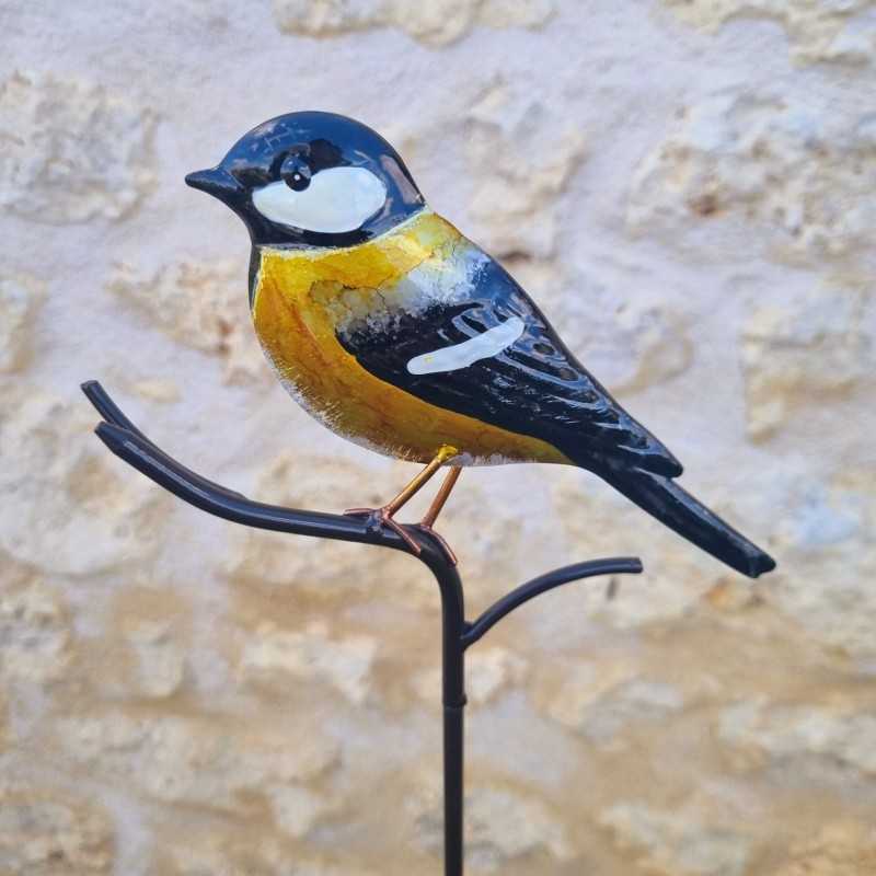 Oiseau décoratif sur pic jaune