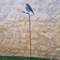 Oiseau décoratif sur pic orange