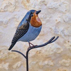 Oiseau décoratif sur pic orange