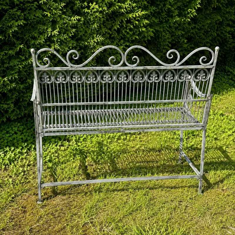 Banc de jardin ancien en métal patiné vert-de-gris vue arrière