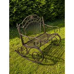 Banc à bascule extérieur en métal marron patiné – vue de coté dans un jardin