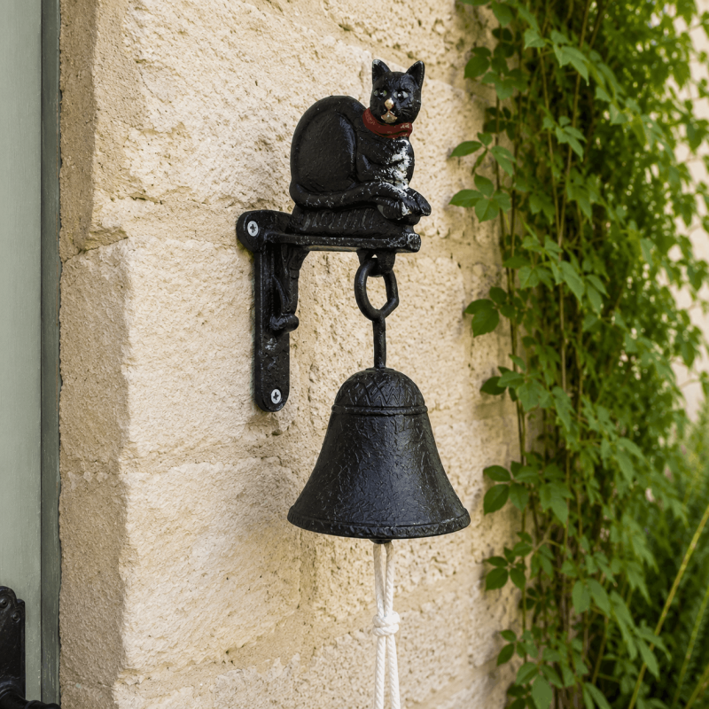 Petite cloche de porte en fonte avec chat noir aux yeux verts